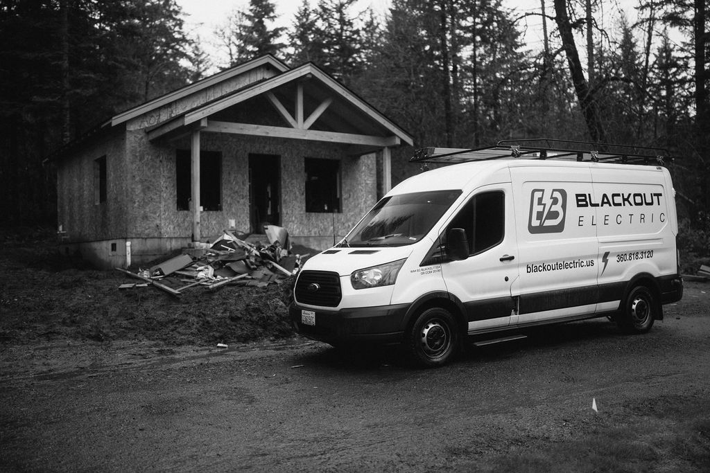 Blackout Electric project van at residential job site
