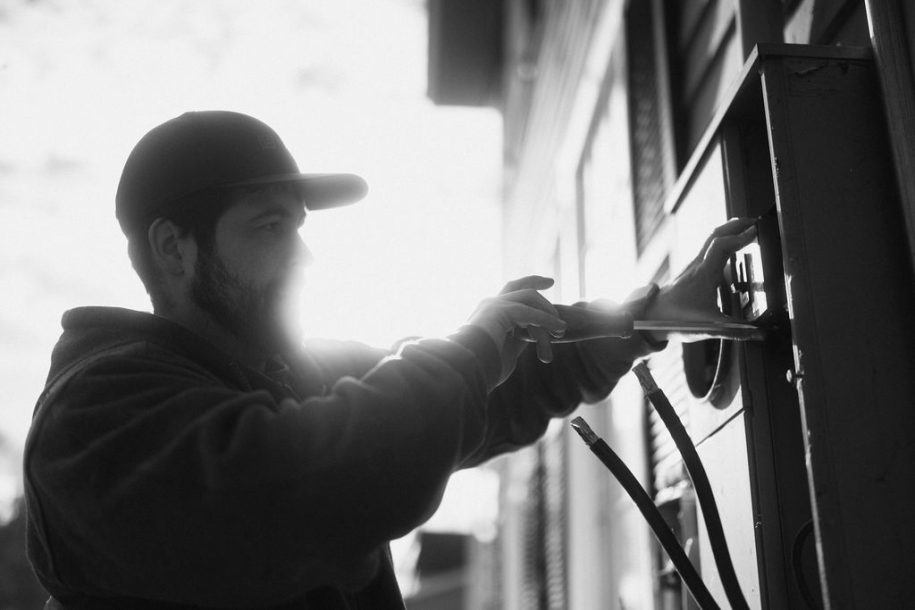 Blackout Electric electrician working on exterior electrical equipment