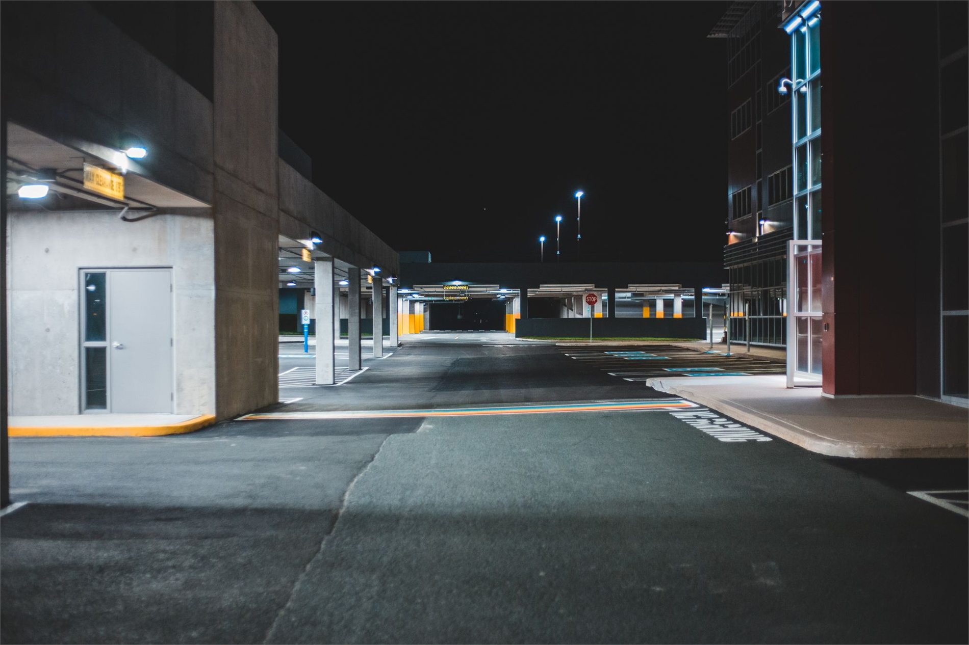Exterior parking area with evenly distributed overhead lighting