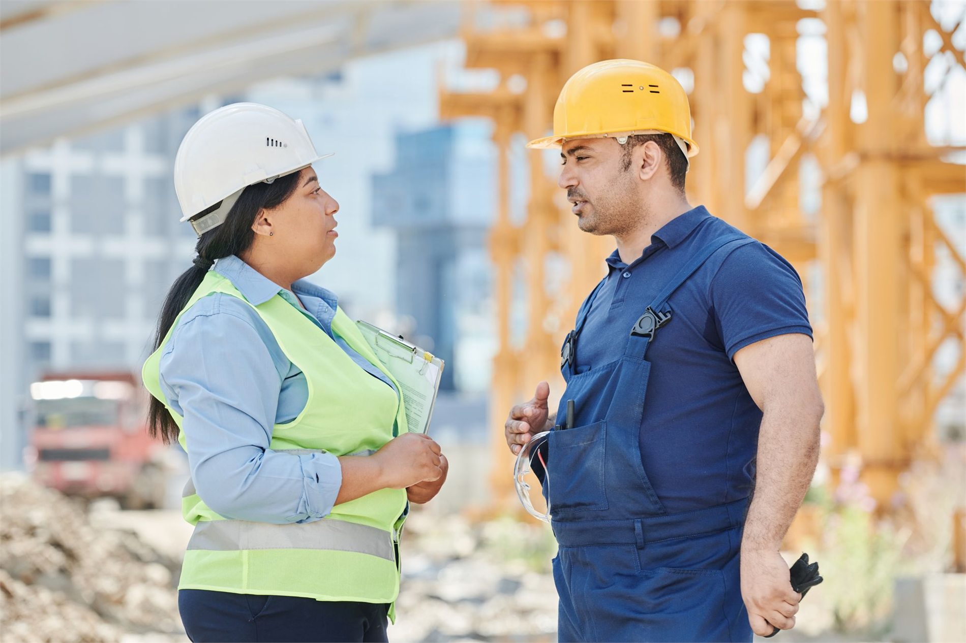 Project team coordinating plans at an active construction site