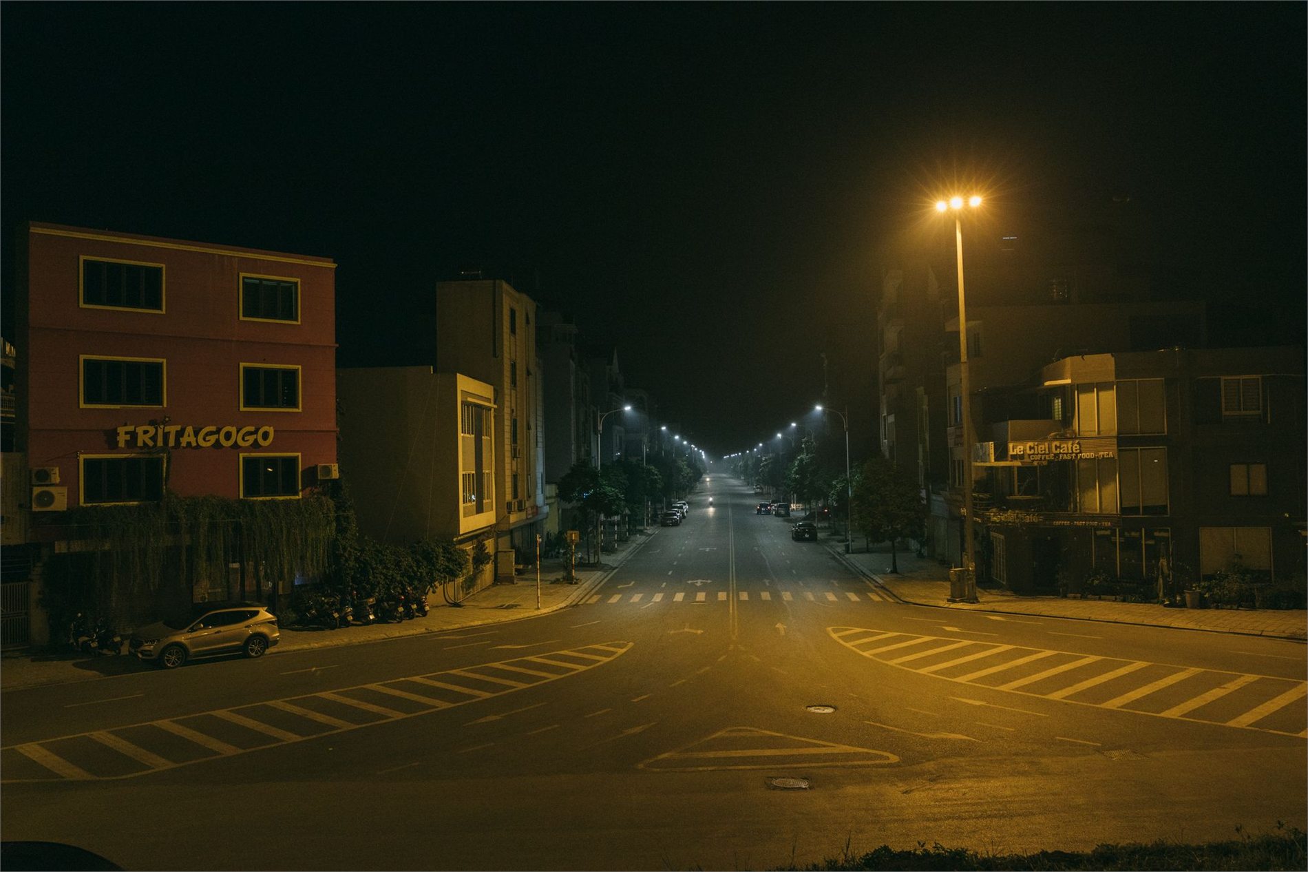 Roadway illuminated by professionally installed streetlights at night
