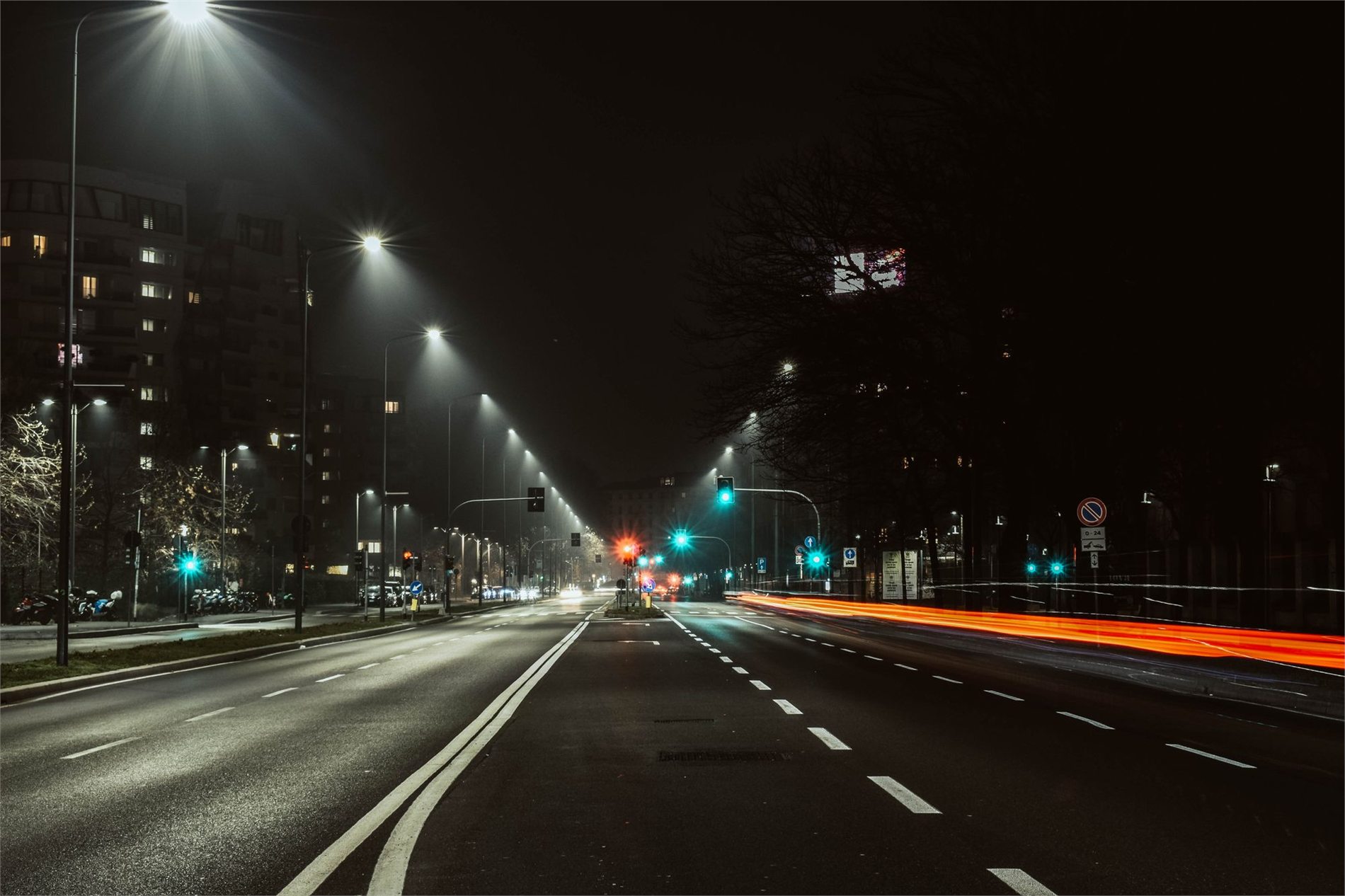Commercial roadway illuminated by streetlights at night