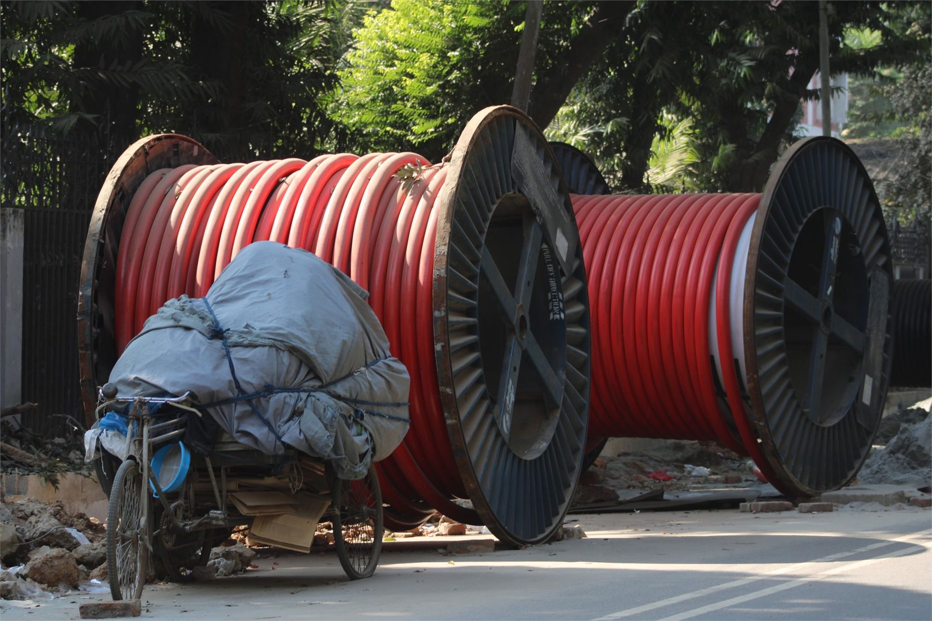 Large electrical cable reels staged for underground installation